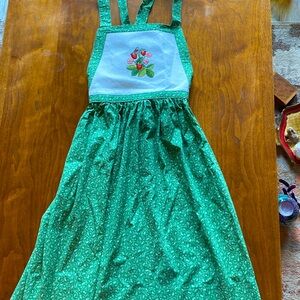 Homemade needlepoint, apron, green and white with flowers and leaves